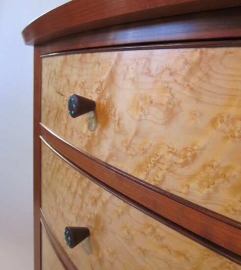 Cherry and figured maple nightstand with curved birdseye maple drawers accented with a fine walnut bead, all set in solid cherry casework