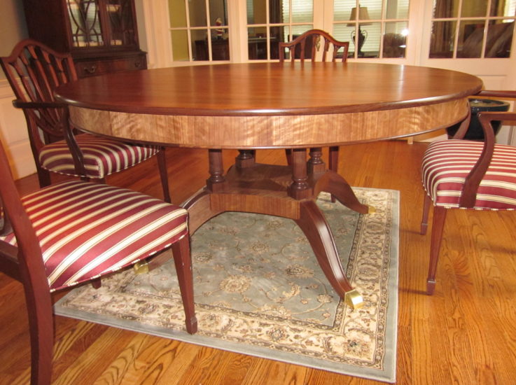 Custom-built traditional Duncan Phyfe dining table in walnut