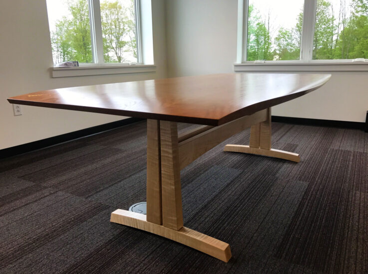 Custom conference table made from solid cherry and soft, curly maple